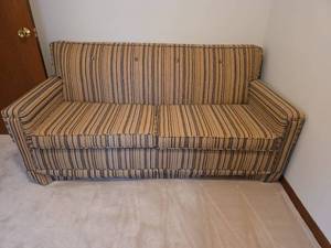 lot 125 image: Tan and Brown Striped Pull-out Sleeper Sofa- Mattress is Still in Plastic