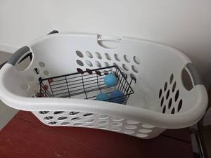 lot 145 image: White Plastic Laundry Basket and Black Wire Basket with Dryer Balls