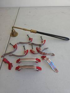 lot 367 image: Streamlined Art Deco Red Chrome Cabinet Pulls with Brass Candle Snuffer