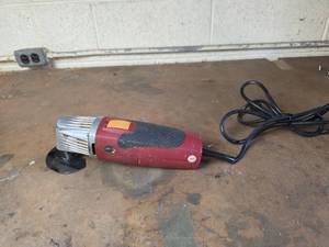lot 506 image: Red Electric Angle Grinder Tool Powers On
