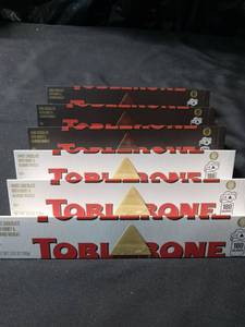 lot 1446 image: TOBLERONE, 3 SWISS WHITE CHOCOLATE WITH HONEY & ALMOND NOUGAT, 3 Dark chocolate with honey & Almond nougat