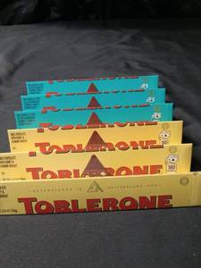 lot 1458 image: TOBLERONE 3 CHOCOLATE BAR CRUNCHY ALMOND WITH SEA SALT TOBLERONE 3 CHOCOLATE BAR MILK CHOCOLATE