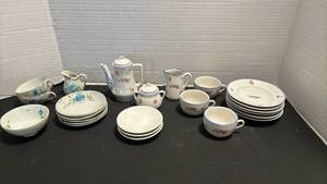 lot 1106 image: Two miniature tea sets.  Neither is complete.