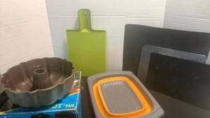 lot 1132 image: Bundt pan cutting boards and colander