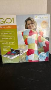 lot 1214 image: AccuQuilt GO Fabric Cutter Machine. See lot 1307 for accessories.