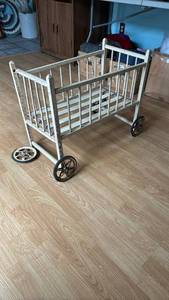 lot 1236 image: Vintage Wooden Doll Crib with Wheels