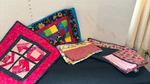 lot 1309 image: Handmade Quilted pieces and two pillow cases - one is for a small pillow and a wall hanging
