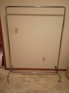 lot 1600 image: Clothing Rack on wheels    66 x 58