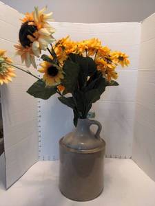 lot 1711 image: American Stoneware 1 Gallon Jug with fake sunflowers