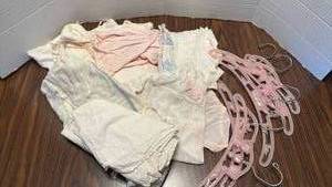 lot 1809 image: Baby Dress Collection with Pink Hangers