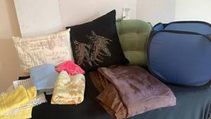 lot 1833 image: Pillows, misc towels, washcloths, brown shear curtain and folding hamper