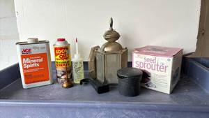 lot 2103 image: Seed sprouted, light fixture, oil can, car ashtray and more
