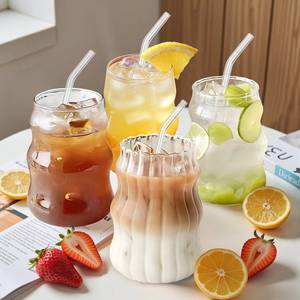 lot 59725 image: UHAPEER Ribbed Glass Cups Set of 4 18OZ Vintage Aesthetic Iced Coffee Glasses with Straws, Cute Drinking Glasses with Wave Shape Design, Matcha Glass Cup Bubble Cups for Juice, Tea, Beverage, Gift - Retail $23