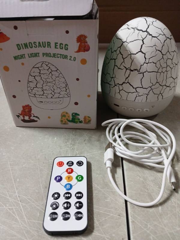 lot 59271 image: Dinosaur Egg Night Light Projector 2.0 - Retail $15