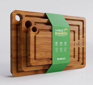 lot 49657 image: Bamboo Cutting Board for Kitchen, 3-Piece Set with Juice Grooves, Side Handles & Non-Slip Mats Durable Bamboo Chopping Board for Meat, Vegetables and Fruits - Retail $50