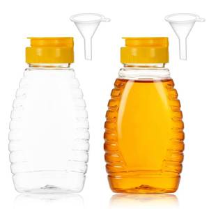 lot 16261 image: ONE LID DAMAGED Xelsluthe 2 Pack Empty Plastic Honey Bottles with Funnel 180ml 6oz Bottles Plastic Honey Dispenser Refillable Leakproof Honeys Dispenser for Storing and Dispensing Mustard Dressing - Retail $7