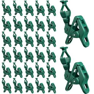 lot 16422 image: C7 C9 Christmas Lights Spring Clips, 100 Count Holiday Lights Quick Spring Clips, Shatterproof Shingle and Gutter Clips for E12, E17Socket, Rope Lights Roofline Fence Railing Mantel Christmas Trees - Retail $60