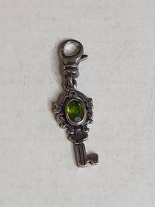 lot 1013 image: Silpada .925 Sterling Silver Key Charm with Peridot Stone