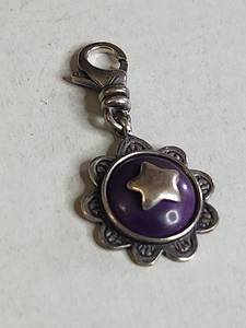 lot 1018 image: Silpada .925 Sterling Silver Purple Enamel Star Charm