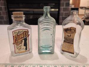lot 87 image: Old Medicine Bottle Collection - Dr. Allans Flower Cure & More
