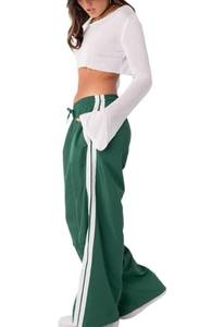 lot 2891 image: UAURORAO Women Y2k Track Pants Baggy Side Striped Joggers Sweatpants Elastic Waist Color Block Parachute Pants with Pockets(Sporty Green,Medium)