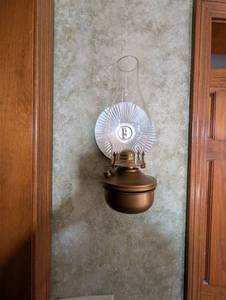 lot 676 image: Wall Mounted Oil Lamp with Reflector