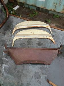 lot 108 image: Original 1950s Chevrolet Fender Skirts and Trunk Panel Set and possible model t hood piece