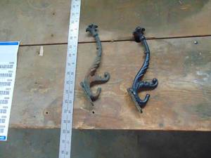 lot 3306 image: Pair of Cast Coat Hangars