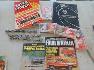 lot 3388 image: Datsun Emblems and Mopar Magazines