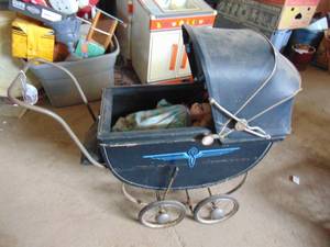 lot 3497 image: Vintage Buggy with 2 Dolls and Curious George