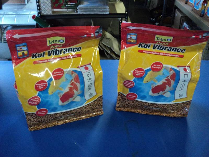 lot 3703 image: (2) bags Tetra Pond Koi Vibrance 2.42 lb. bags