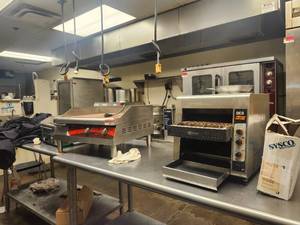 lot 15513 image: Assorted Lot W Star Holman QCS Conveyor Toaster, Avantco 24 Griddle, Waring Griddle, and Carpet Mat