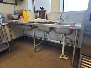 lot 15594 image: Commercial Stainless Steel Prep Table with Sink And Contents