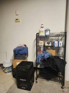 lot 15648 image: 4-Tier Shelving Unit W Cleaning Supplies, Mops, Milk Crates and More