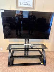 lot 1004 image: TLC Roku TV & Stand 66--FR