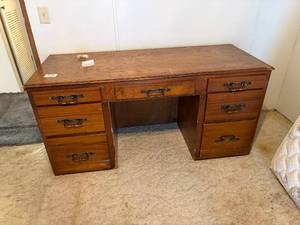 lot 1070 image: Oak 7 Drawer Desk 63 x 25 x 30-- BR1