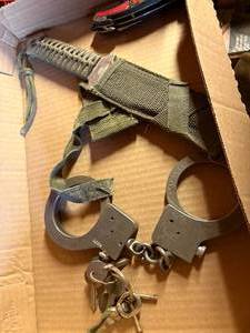 lot 1156 image: Hand Cuffs & Knives-- WW