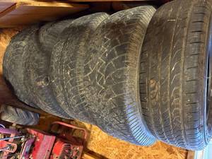 lot 1205 image: Tires- (4) 31 x 10.5 x 16 Wild Country & (1) Toyo 225 60 R17-- CS