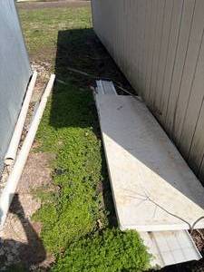 lot 1295 image: Pipe, Tin Snip & Items Between Buildings-- Outside S
