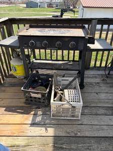 lot 1304 image: Blackstone Flat top w Propane Tank & Two Baskets of Misc.-- D