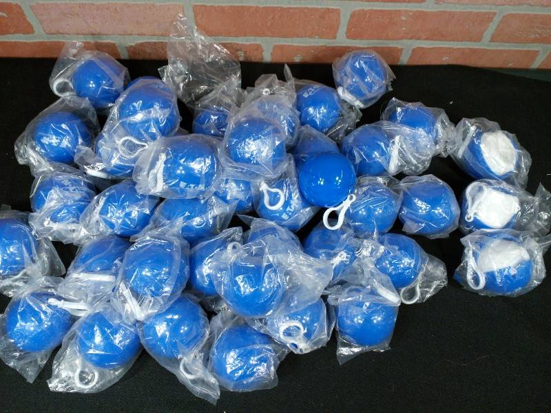 lot 9 image: Ball with Logo Key Chain - Contains Rain Ponchos