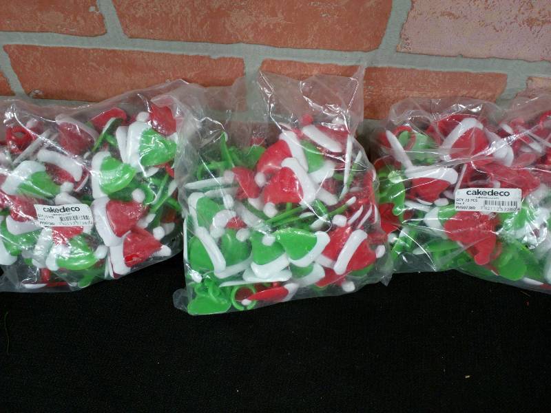 lot 43 image: Cake Deco Santa Hat Cupcake Ring DecorationsTreasure ChestGive-Aways
