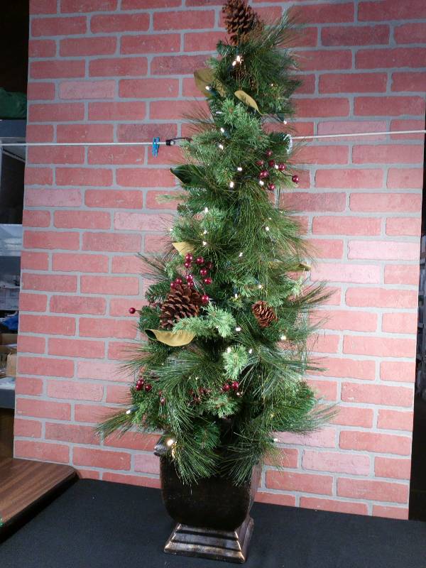 lot 70 image: Cordless 4.5 Foot Potted Pre-Lit Lodi Pine Tree With Timer
