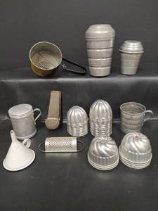 lot 278 image: Aluminum Kitchen Measuring Set with Sifter, Molds and More