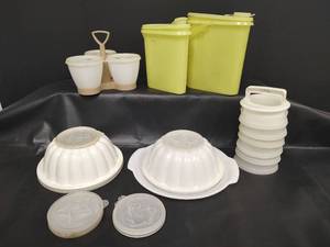 lot 395 image: Vintage Tupperware Storage Collection, Jello Molds, Three Canister with Holder, Hamburger Press and More