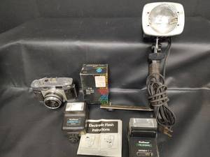 lot 460 image: Ricoh Camera with Kalimar Mini Mite Flash Kit Model 173, Sylvania Sun Gun ll Light Meter Chart and More