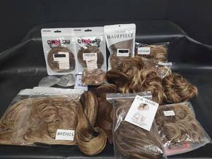 lot 553 image: Hair Extensions and Hairpiece Collection, Ponytail Extensions, Tousled Donuts Various Lengths and Claw Clip Extensions. Various Browns and Blonds Mixed