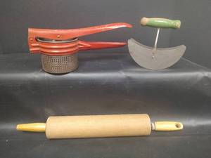 lot 569 image: Vintage Metal Potato Ricer, Vtg Pastry Cutter with Green Wooden Handle and Vtg Wooden Rolling Pin