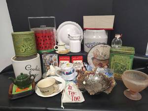 lot 704 image: Mixed Kitchen and Collectibles Lot with Tins, Glassware, and Ceramics