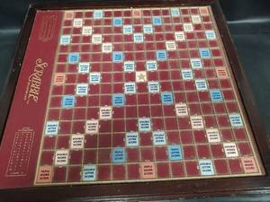 lot 724 image: Scrabble Deluxe Edition Wooden Game Board with Rotating Base and Storage Drawer